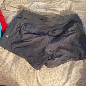 Lululemon speed up shorts size 6. 2.5 inch grey green color